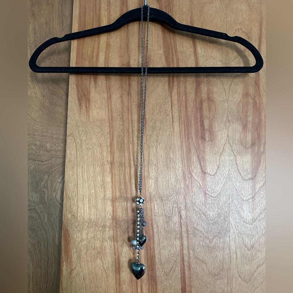 Guess 20” pendant necklace with G logo, heart and other charms.